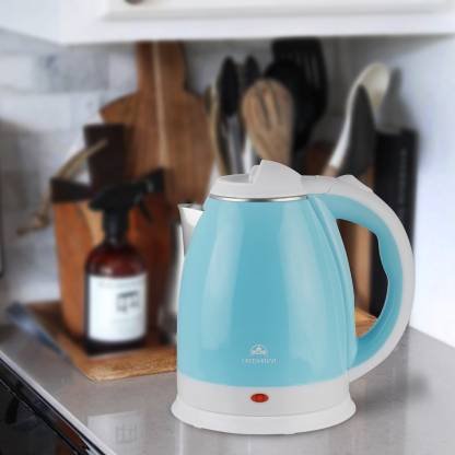 stainless steel skyblue color electric kettle on table