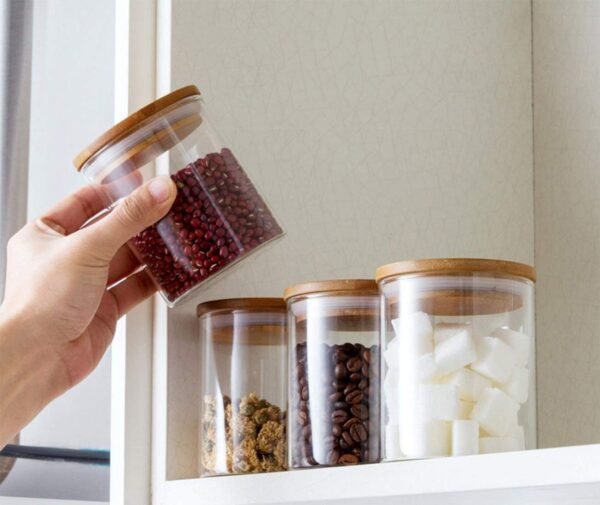 Transparent glass food storage container set on shelves
