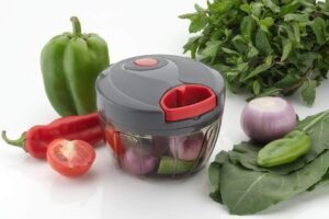 450 Ml manual quick dori chopper cum beater with vegetable on table