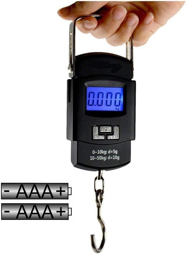 Black color luggage weighing scale in hand on white background
