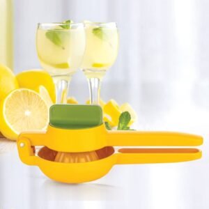 hand squeezer with lemon juicer on table