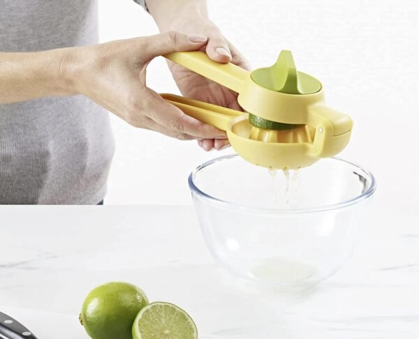 woman squeezing lemon in a bowl