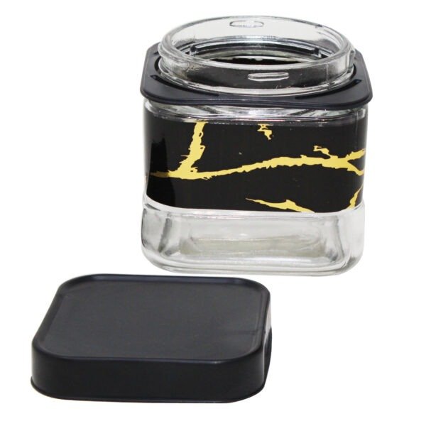 open glass canister with plastic lid on white background