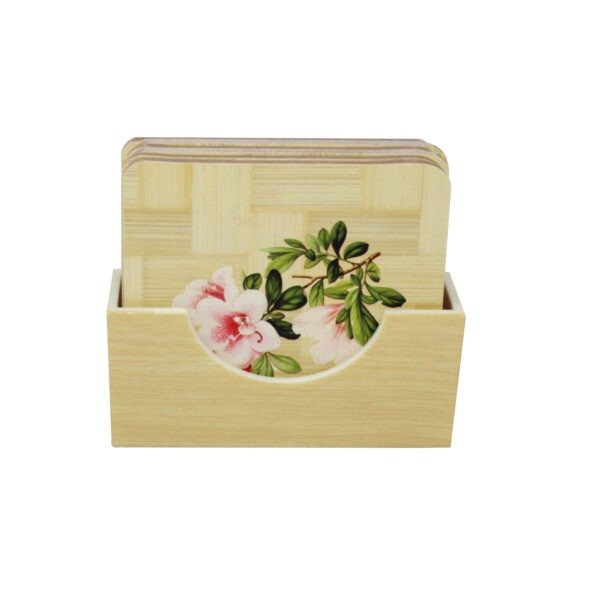 square coaster with flower design on it with stand on white background