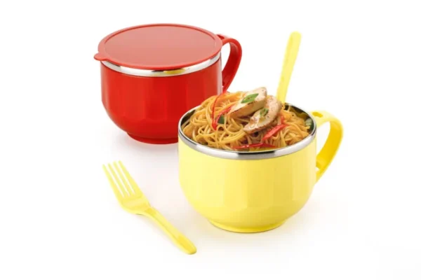 Red and yellow color maggie bowl filled with maggie with fork on white background