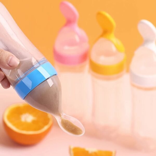 Different color silicone feeding bottle on colorful background