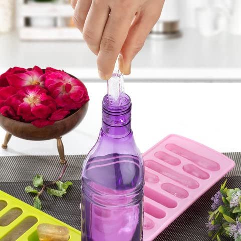 dropping cylindrical ice cubes in bottle