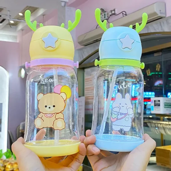 different color plastic sipper bottle in hand