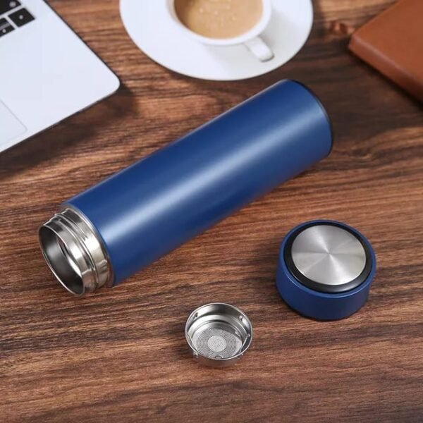 Blue color double wall water bottle on table