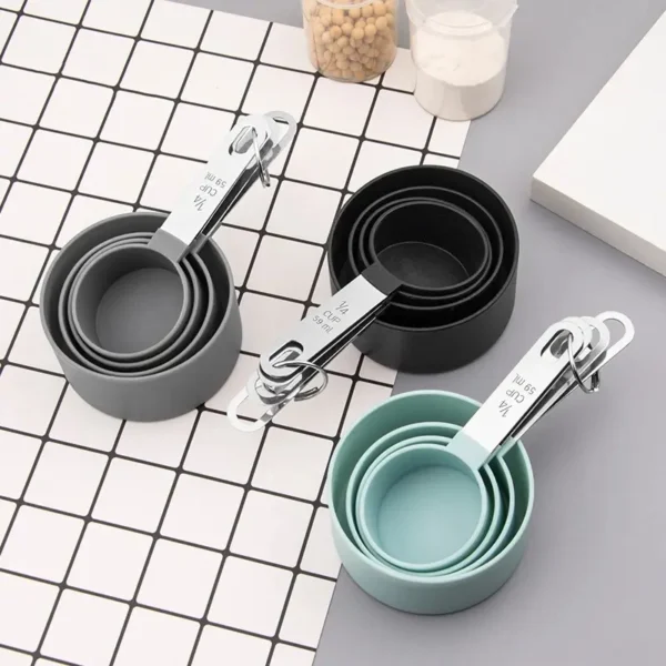 Black Grey and Green color silicone measuring cups on table
