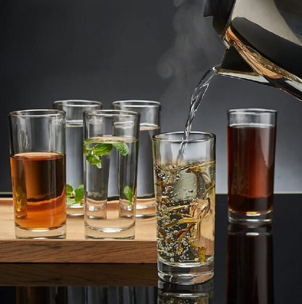 Premium glass plain water glasses set filled with water and soft drinks on table