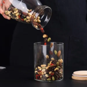 Filling glass storage container with dry fruits
