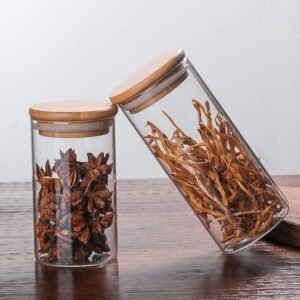 Transparent glass storage container having dry fruits in it