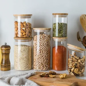 Glass storage container having different sizes on decorative background