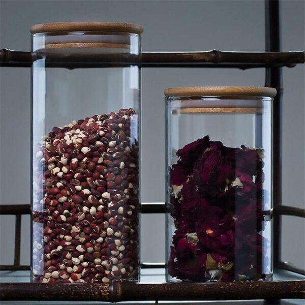 two pieces of glass storage container having different sizes on decorative background