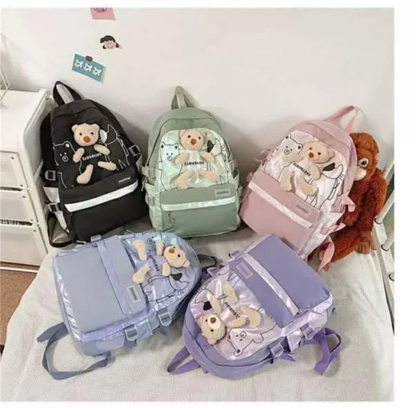 Assorted color kids school bags on decorative background