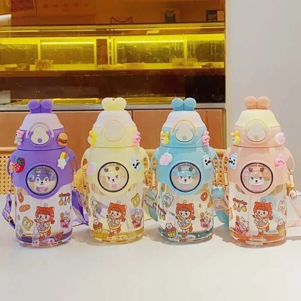 Transparent plastic kids sipper bottle different color on decorative background