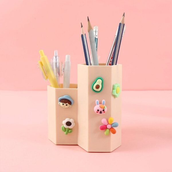 emboss stickers on pencil holder on pink color background