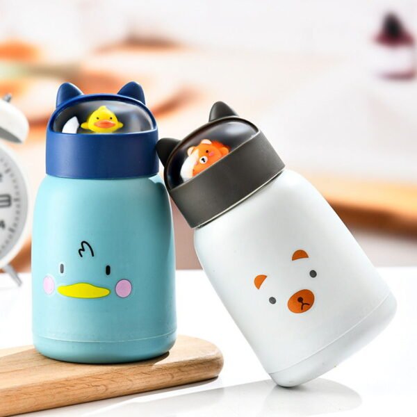 white and blue color glass bottle with cute cartoon on decorative background