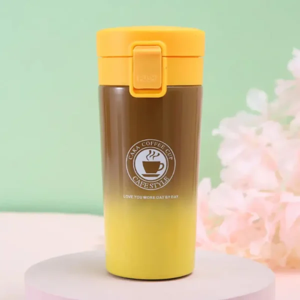 Yellow dual shade insulated hot and cold coffee mug on decorative background