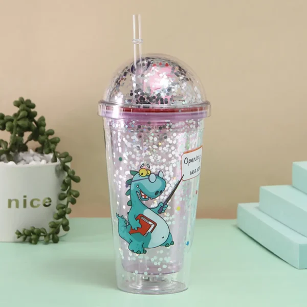 Glitter sipper with straw and lid on decorative background