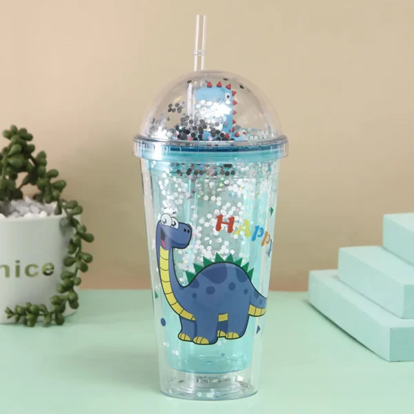 Transparent dino print sipper with glitter lid on decorative background
