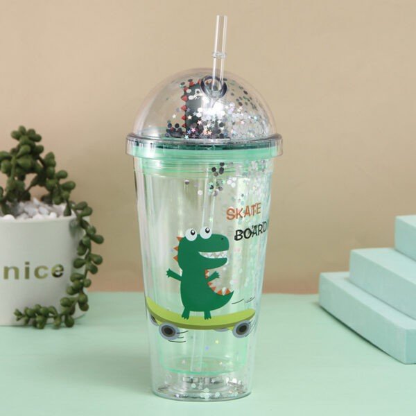 Dino print tumbler with straw on decorative background