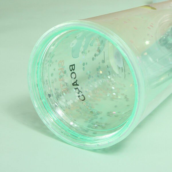 Inner view of transparent acrylic sipper on green color background