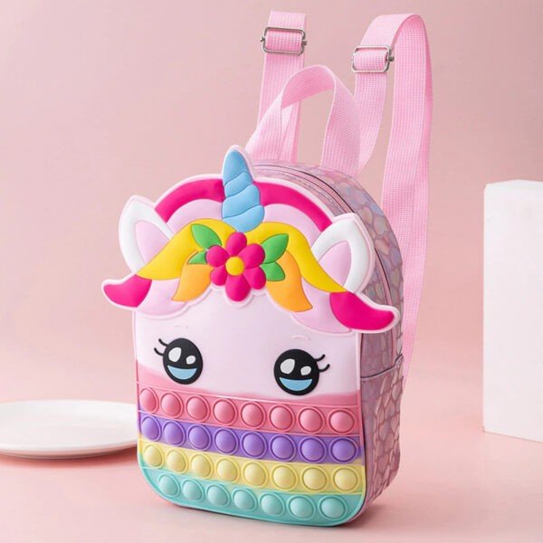 kids unicorn popit backpack from side angle showing carry straps on pink background