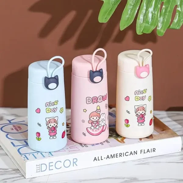 Three pieces of different colors glass water bottle on books having decorative background
