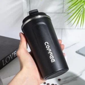 Black color coffee mug in hand