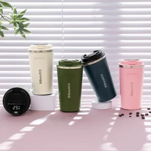Assorted color coffee mug with smart LED temperature display on decorative background