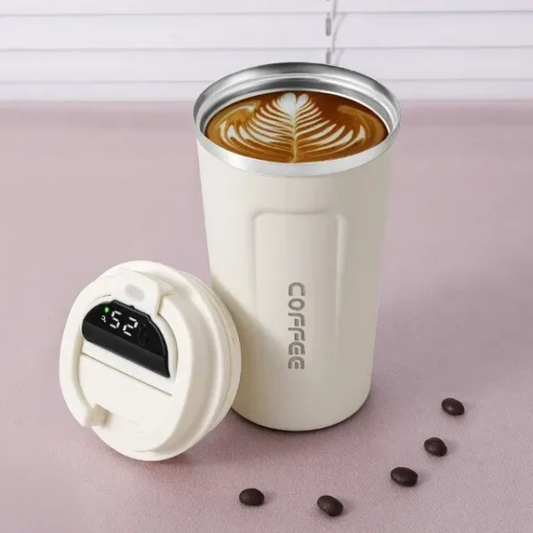 White color coffee filled with coffee with smart led temperature display on decorative background