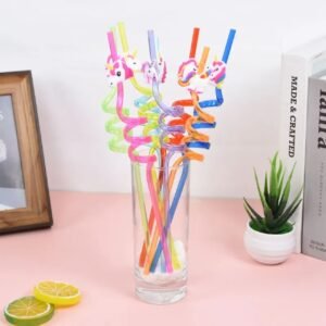 plastic spiral straw in glass on decorative background