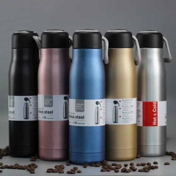 Assorted colors 550 ml vacuum flask bottle on decorative background