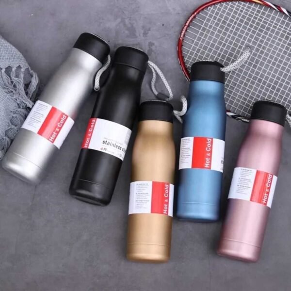 Stainless steel vacuum sport bottle different colors on decorative background