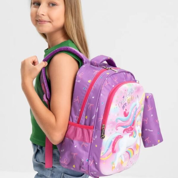 Pink color backpack hanging on shoulders on white background