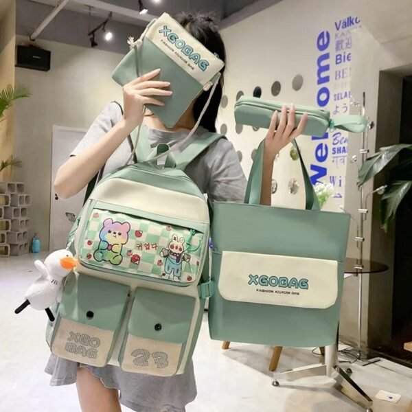 4 Pcs backpack set for kids green color in girl's hand