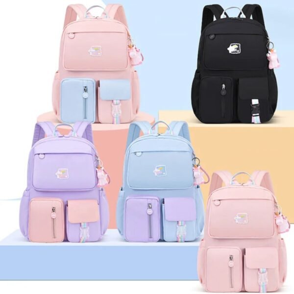 Korean style kids school backpack assorted colors with Unicorn pendant podium on decorative background
