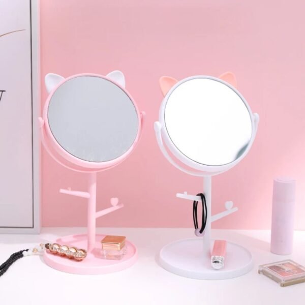 cat ears shaped mirror different colors on decorative background