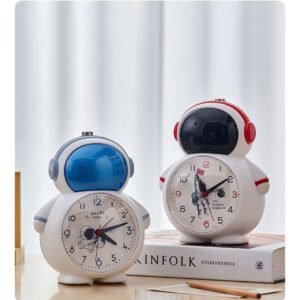 Astronaut bright alarm clock different colors on table