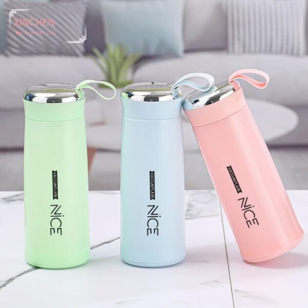 printed glass water bottle different colors on decorative background