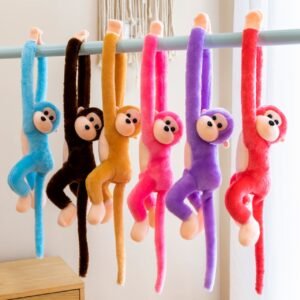 Sholder Hanging monkey toy different colors on decorative background