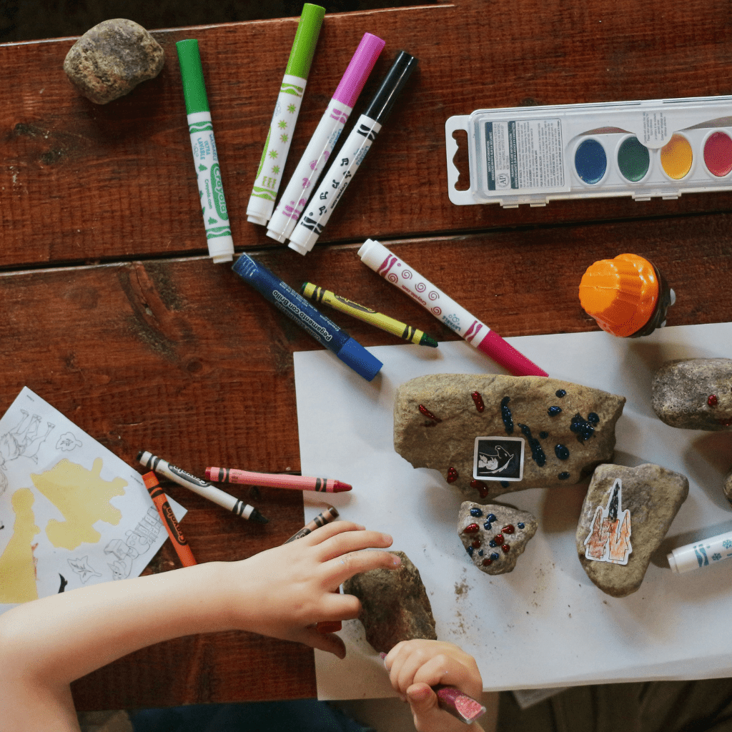 Kids enjoying while coloring using pen colors