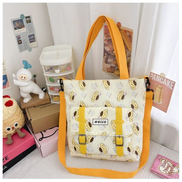 Cinnamon printed yellow color tote bag with adjustable strap on decorative background