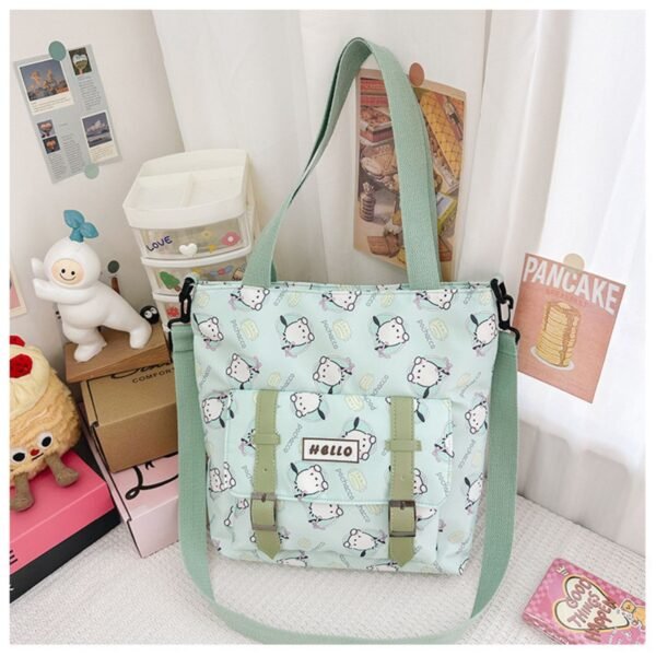 Green color Sanrio family tote bag with adjustable strap on decorative background