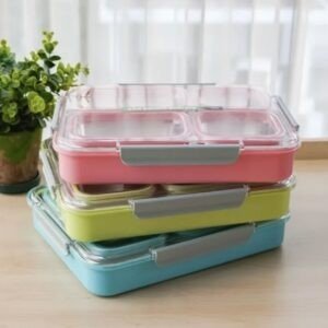 4 Compartment Lunch Box Different colors on table with decorative background