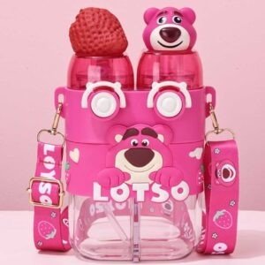 Pink color double water bottle sipper with strawberry and Losto character on the top character "Lotso" written on it. This bottle with adjustable shoulder strap. Bottle placed on table with pink background