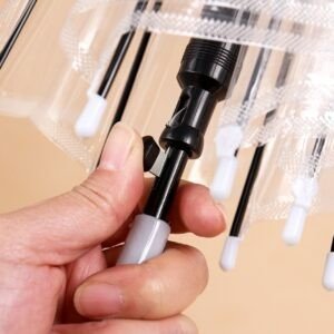 Close up view of the black automatic opening mechanism and runner on a transparent umbrella shaft.