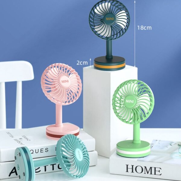 Mini Table Fan pink and green colors with decorative background